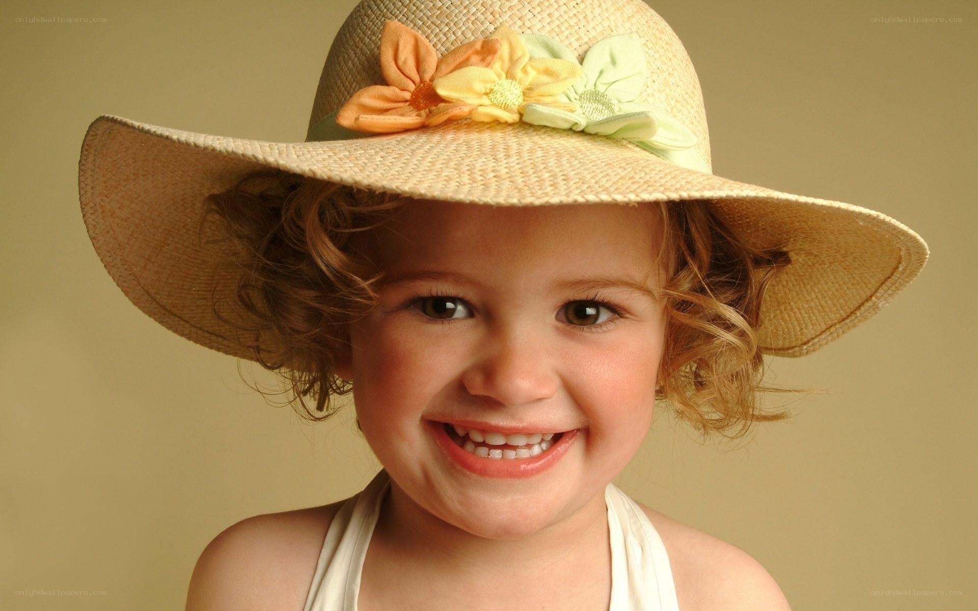Smiling child in straw hat