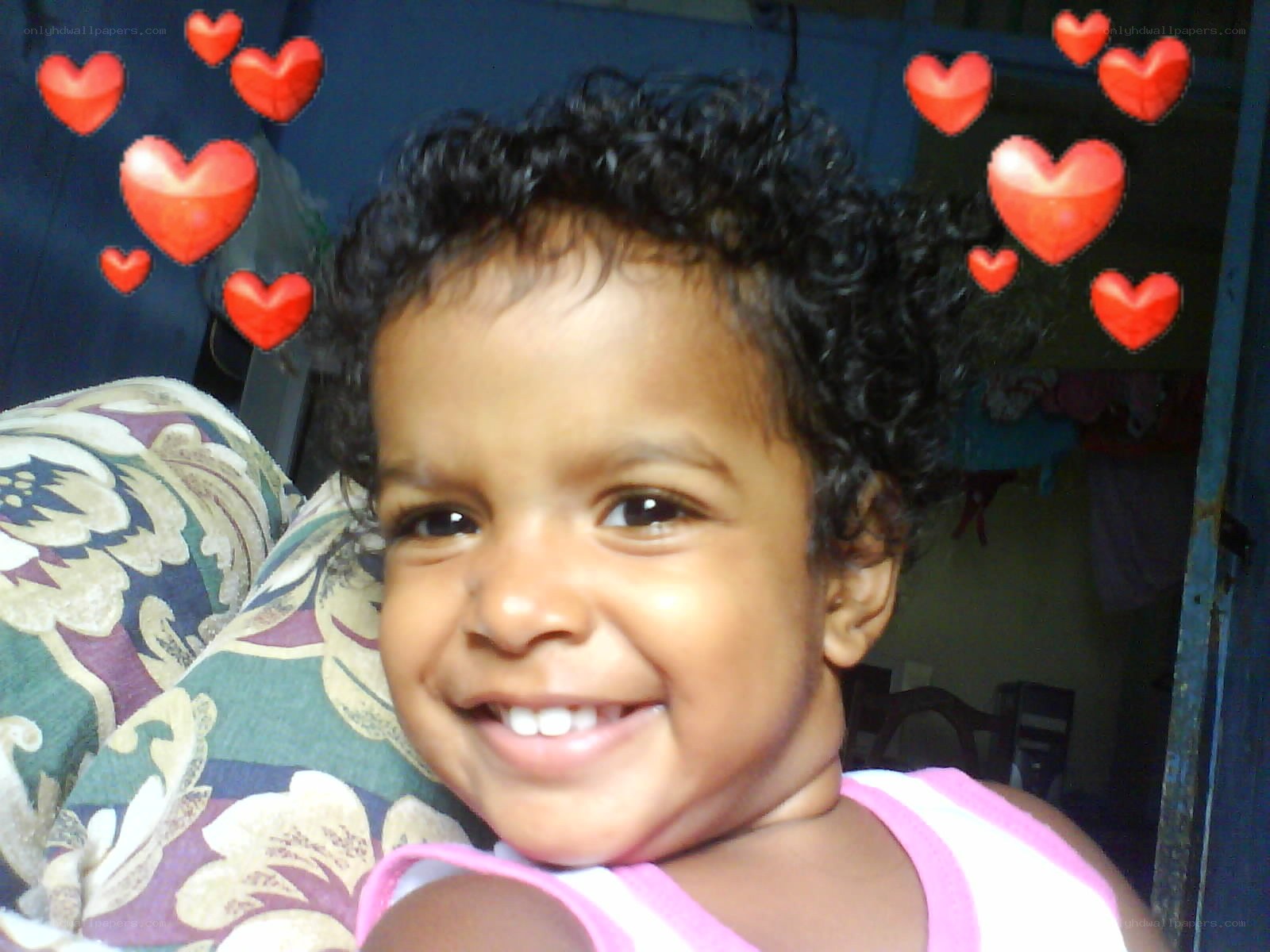 smiling child with hearts