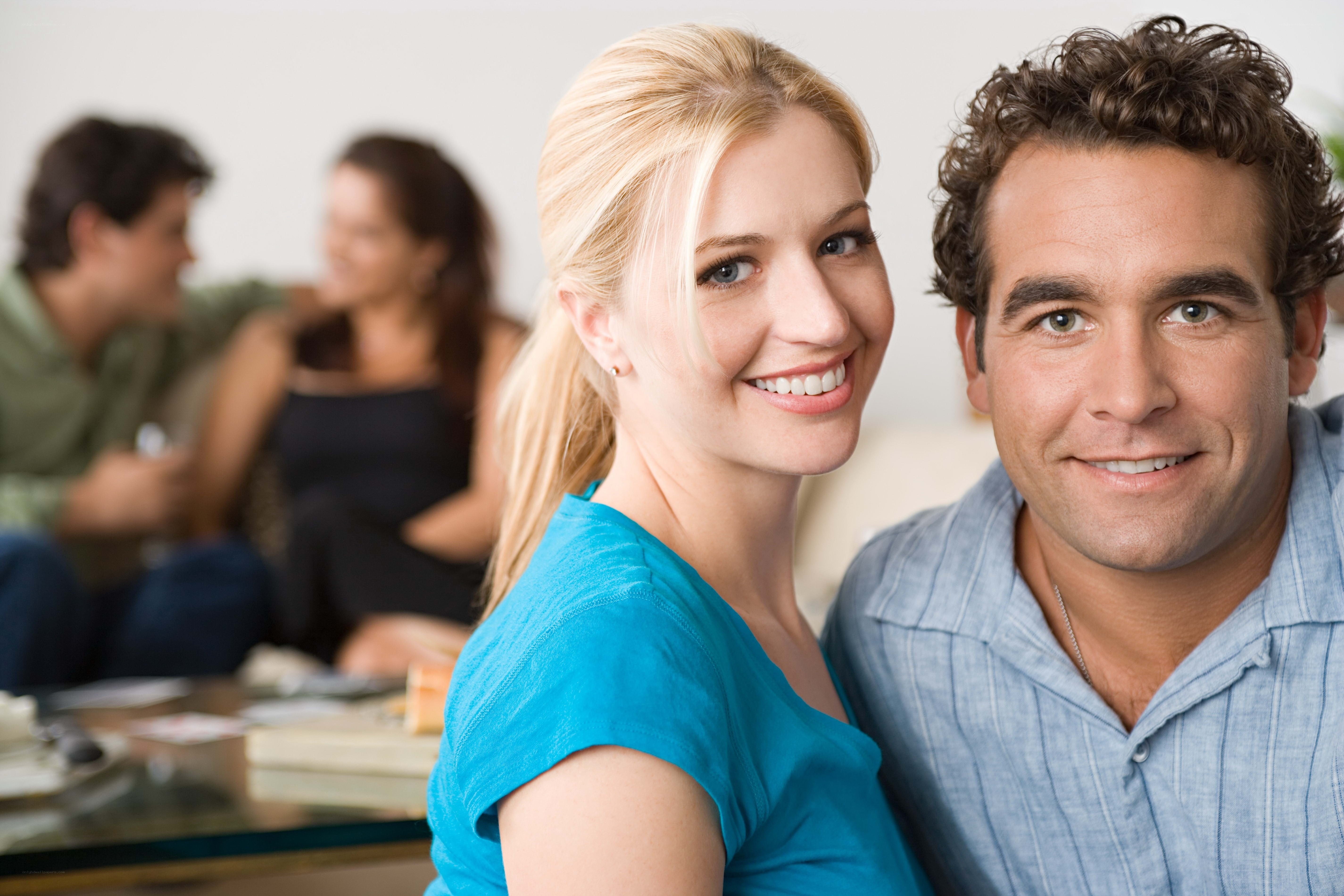 smiling couple at home