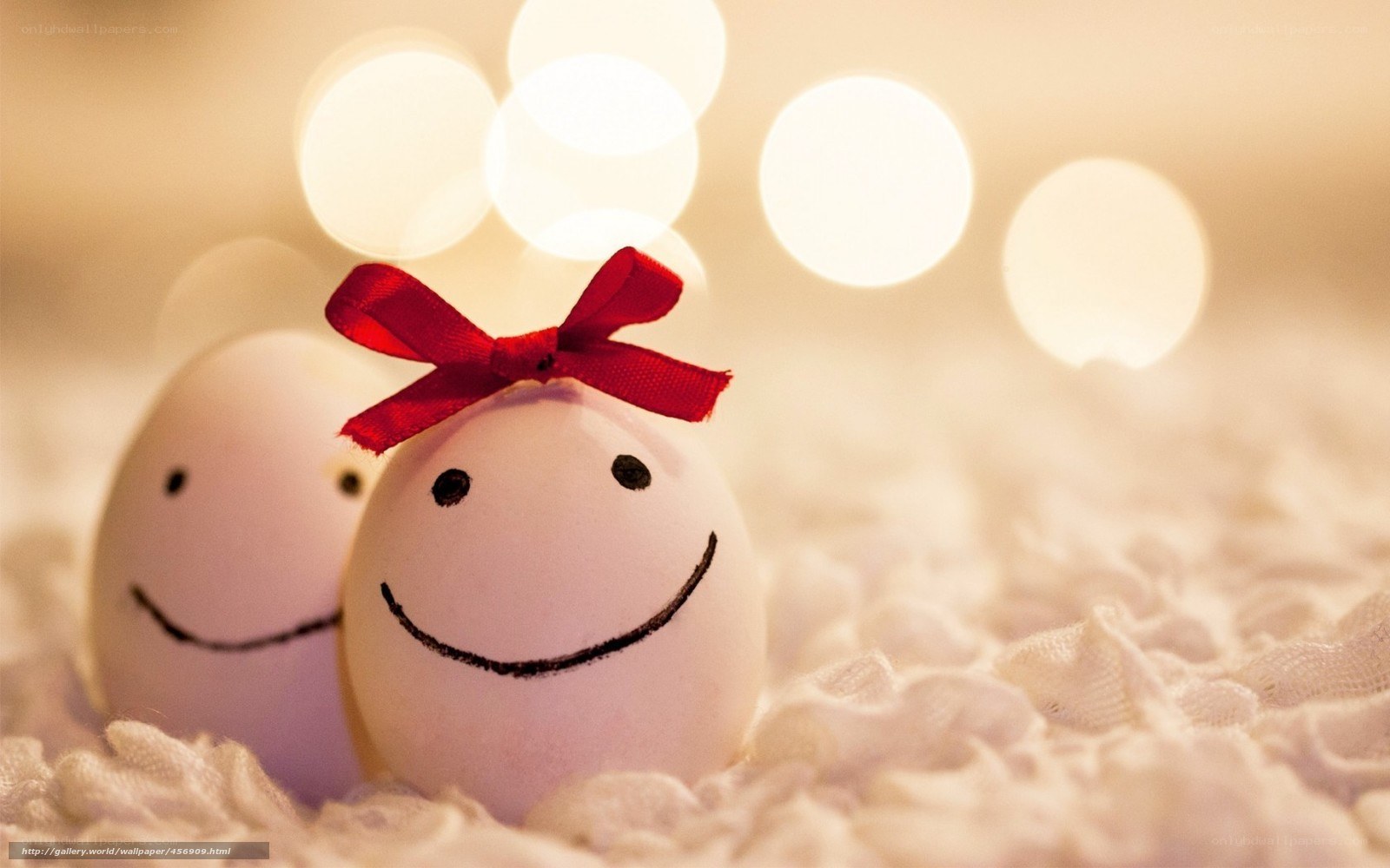 Smiling eggs with red bow