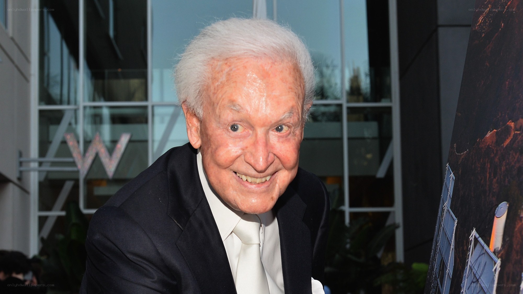 Smiling elderly man at event