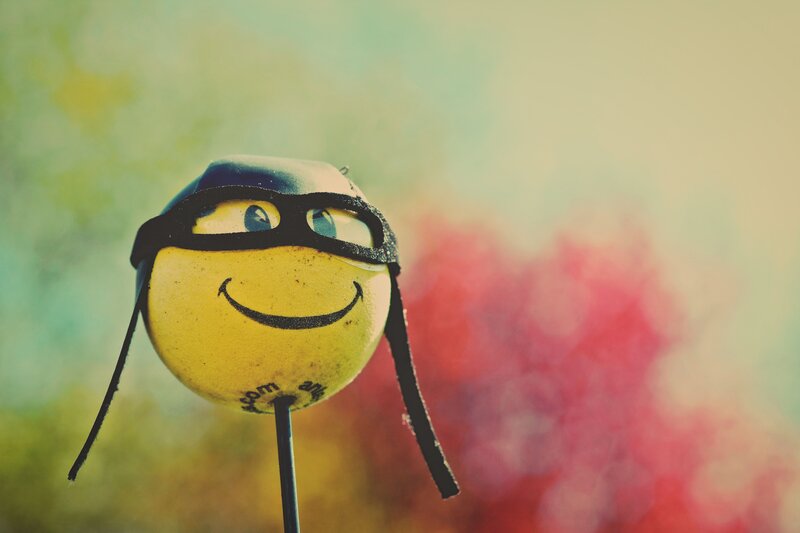 smiling emoji with goggles
