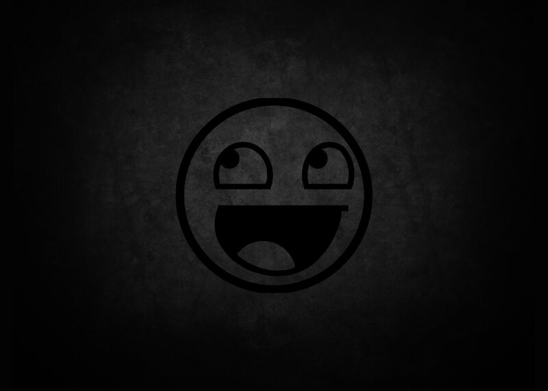 smiling face emoji on dark background