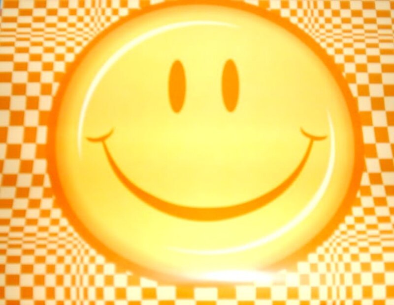 smiling face on checkered background