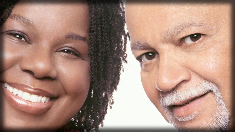 smiling faces of two people