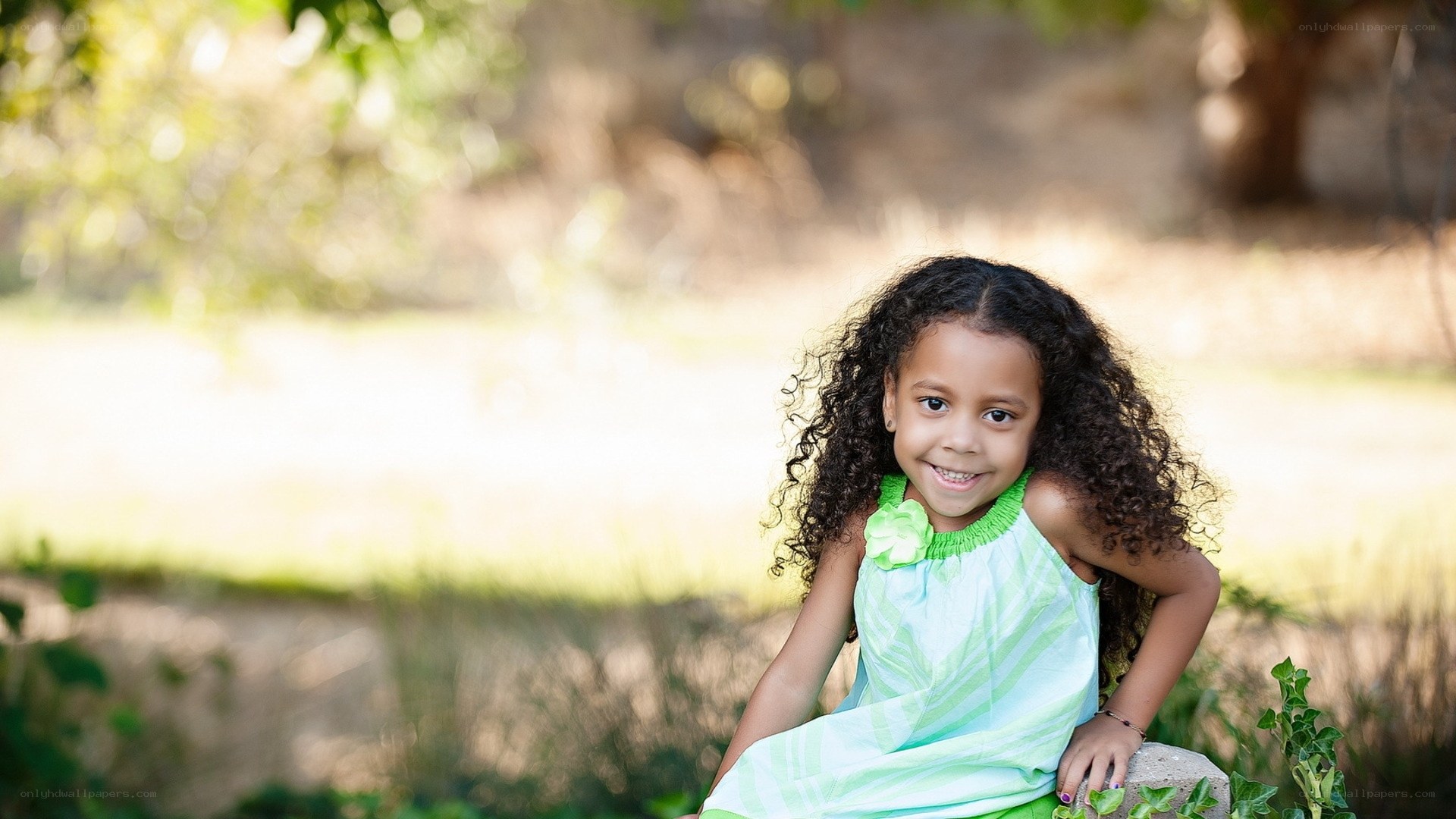 smiling girl in green dress