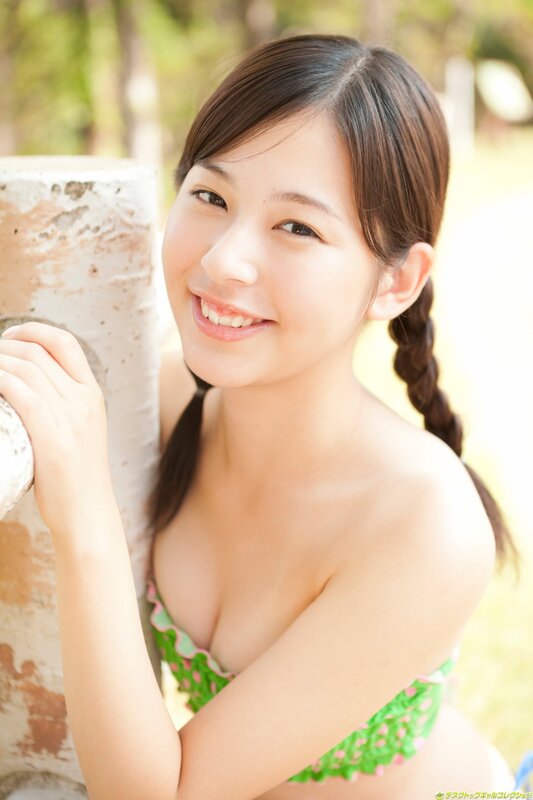 smiling girl in green swimsuit