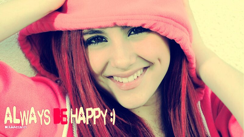 smiling girl in pink hoodie