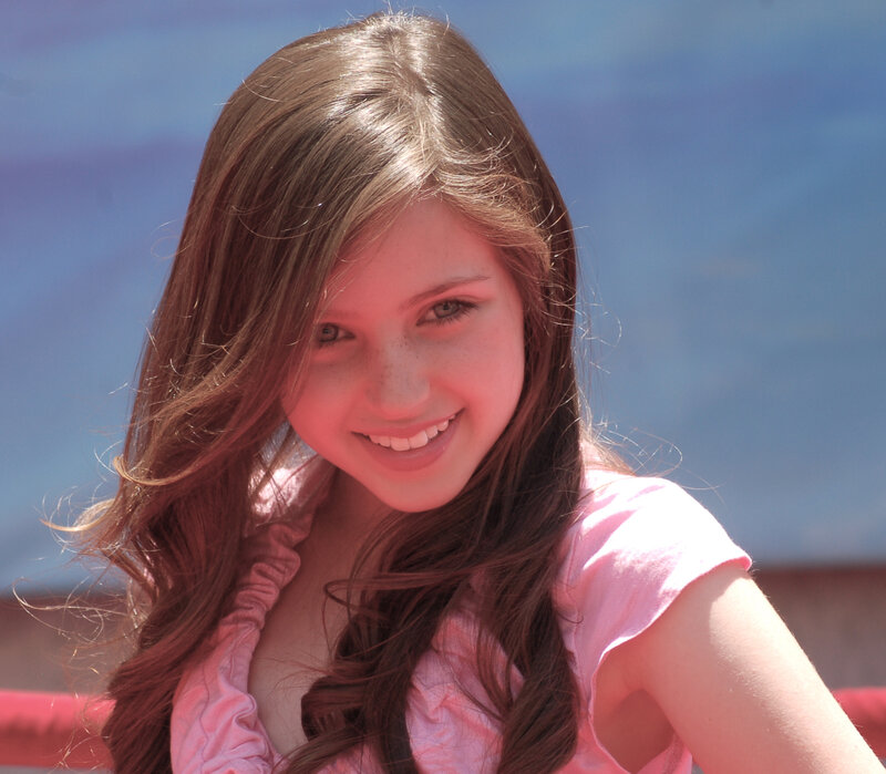 smiling girl in pink shirt