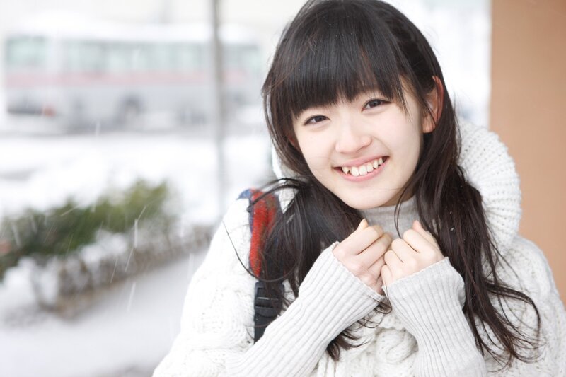 Smiling girl in snowy weather