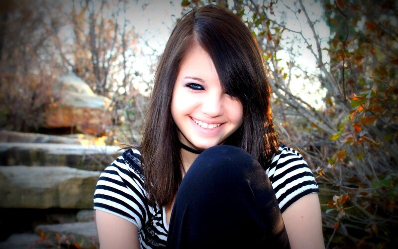 smiling girl in striped shirt