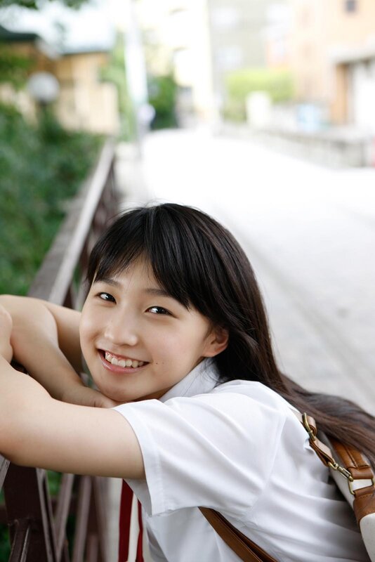 smiling girl in white shirt