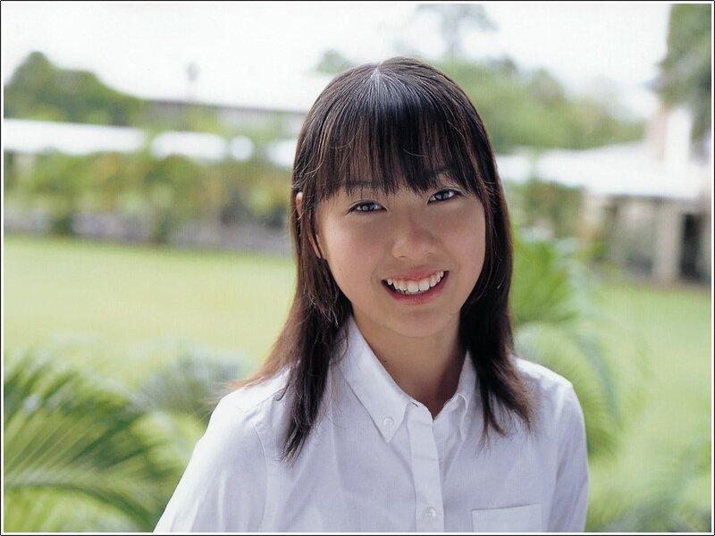 smiling girl in white shirt