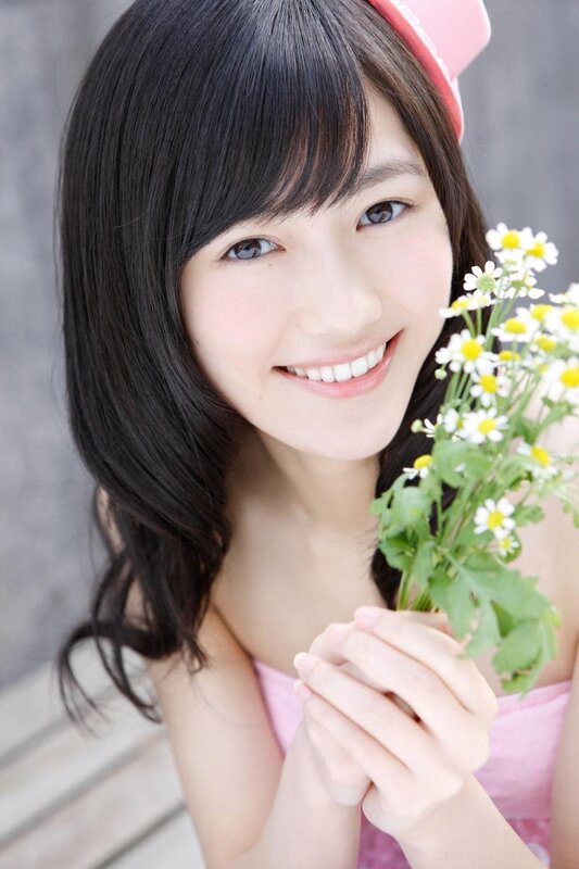 Smiling girl with flowers