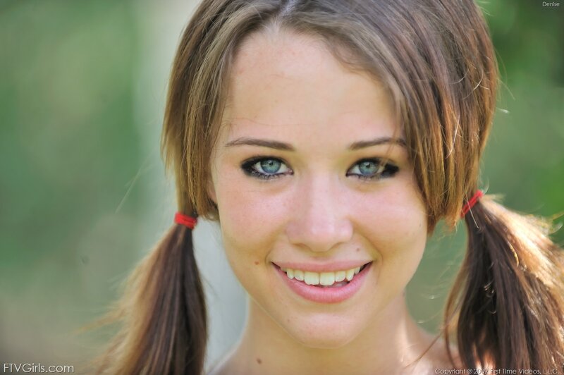 smiling girl with pigtails