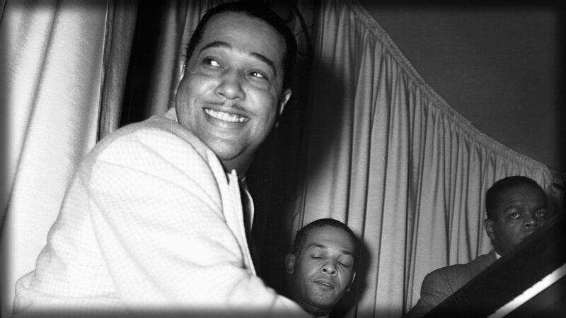 Smiling man at a performance