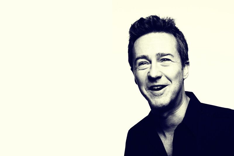 smiling man in black shirt
