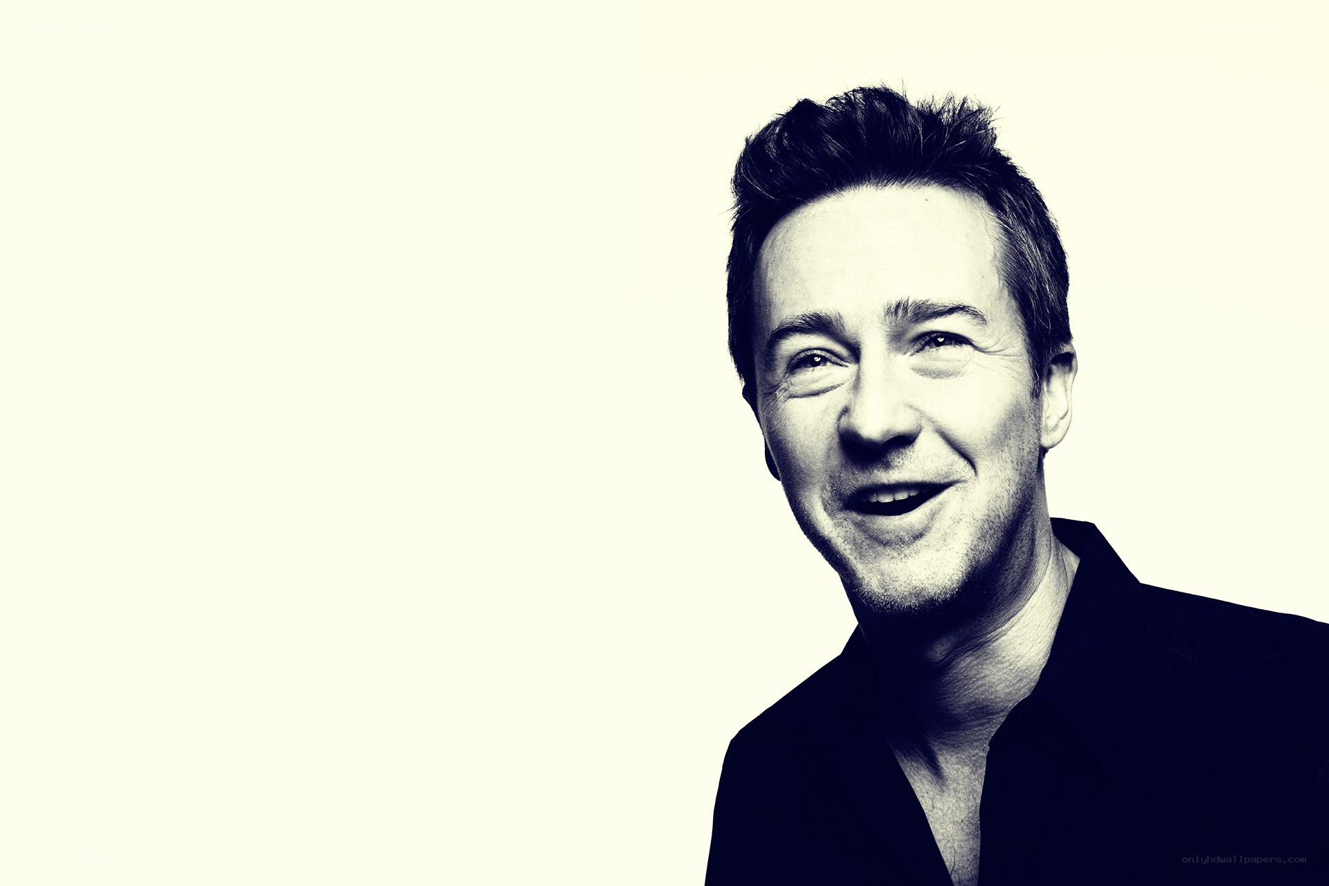 smiling man in black shirt