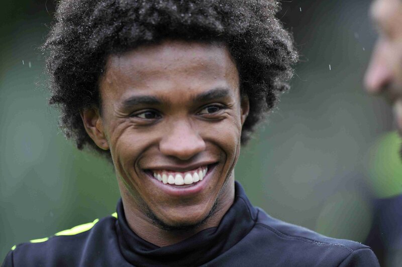 smiling man with curly hair