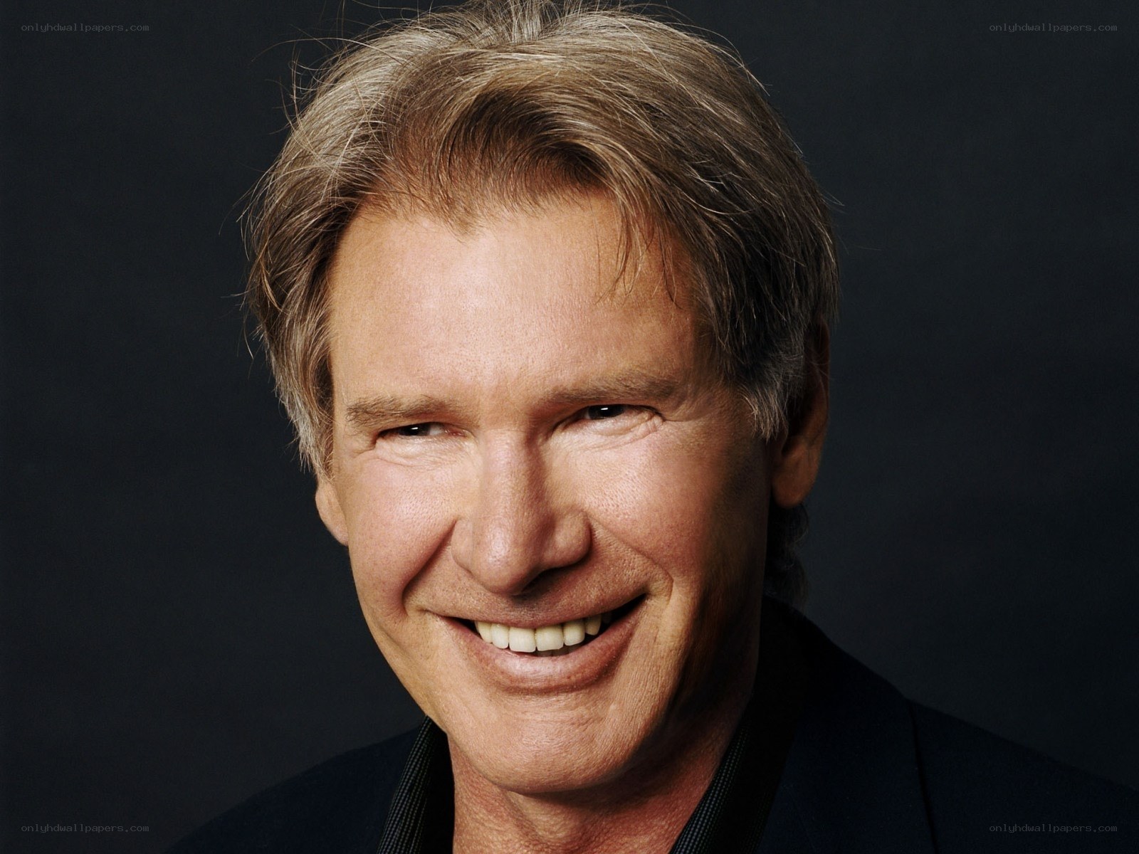 smiling man with gray hair