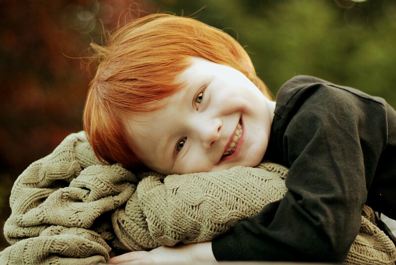 smiling red-haired child