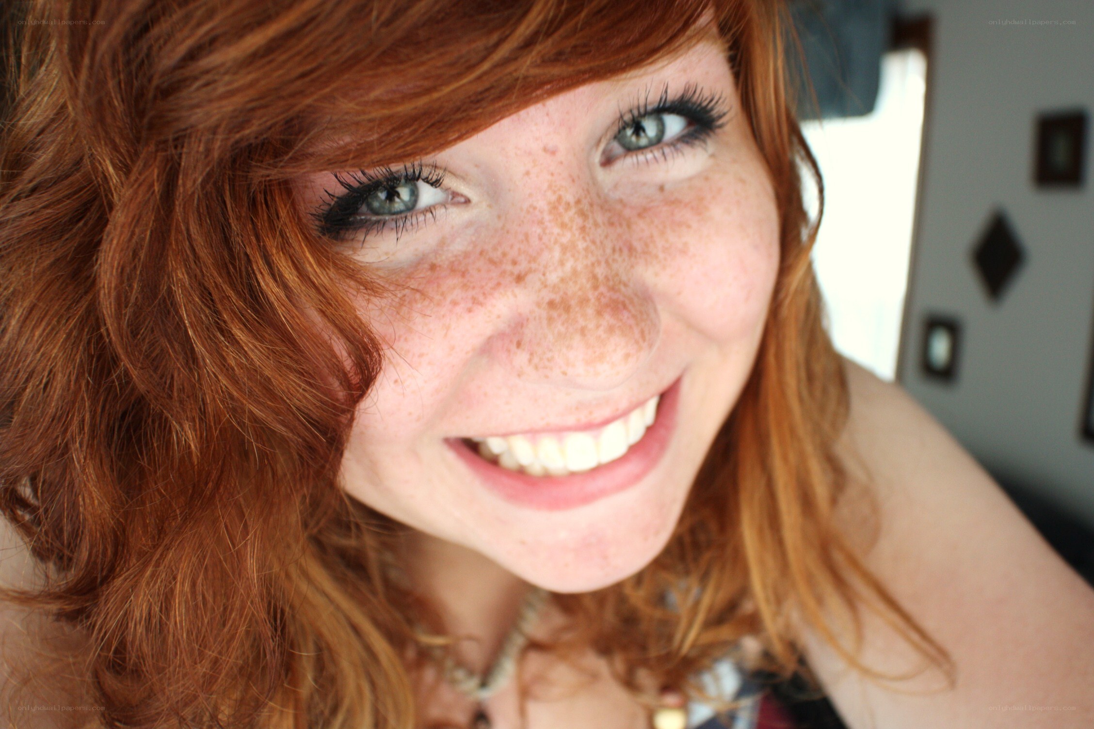 smiling red-haired woman