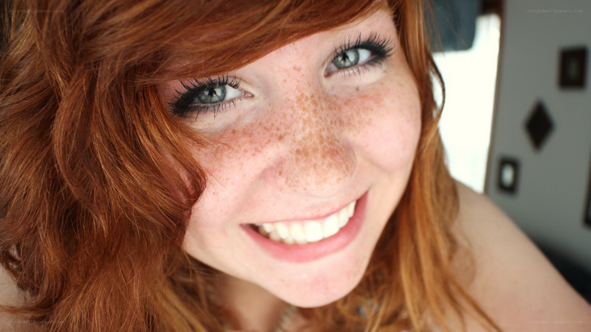 smiling red-haired woman
