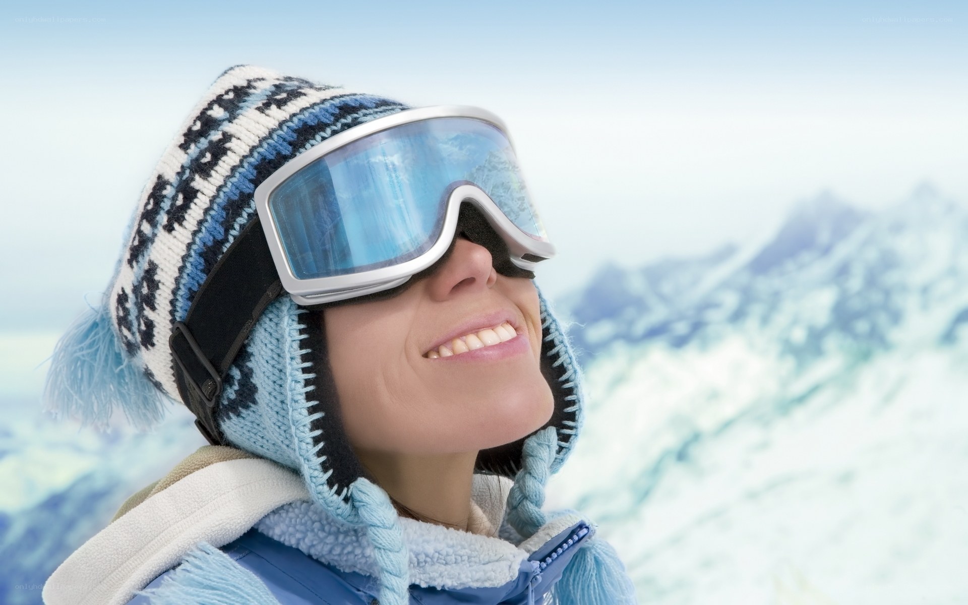 Smiling skier on snowy mountain