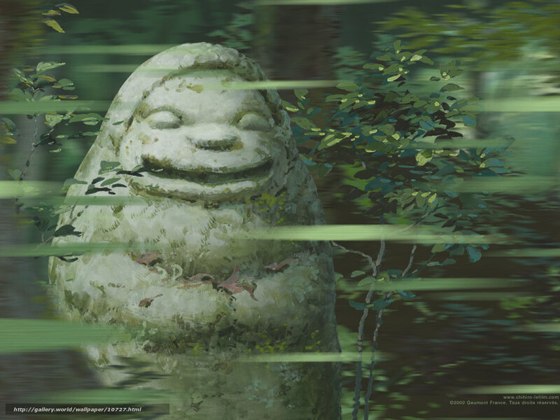 Smiling stone statue in forest