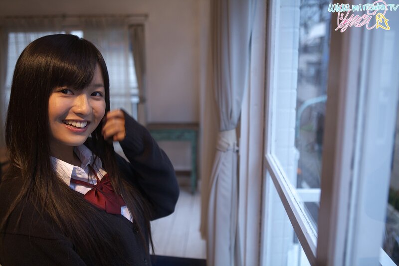 Smiling student by the window