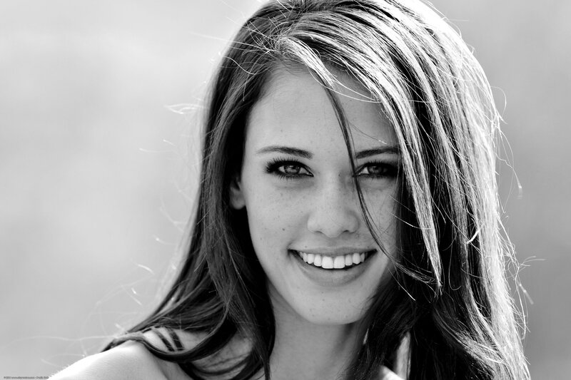 smiling woman in black and white