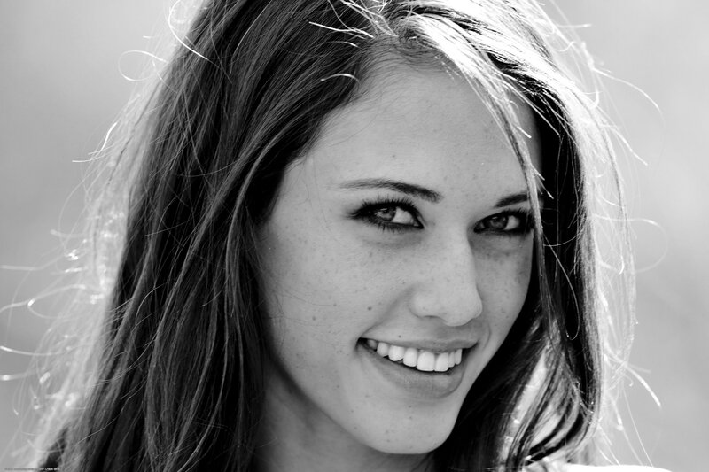 smiling woman in black and white
