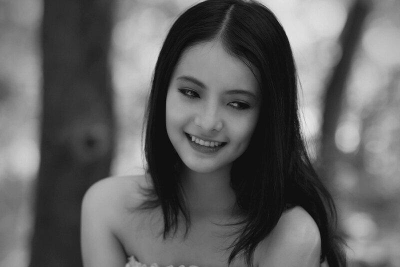 smiling woman in black and white