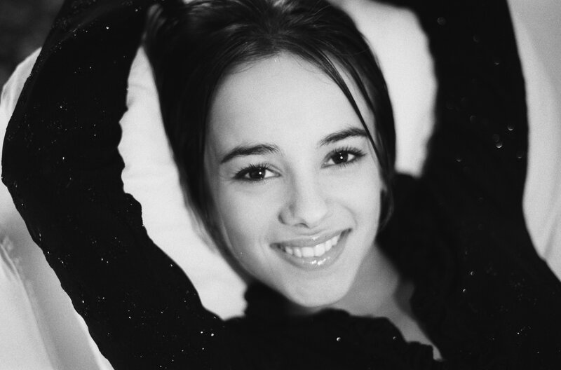 smiling woman in black and white