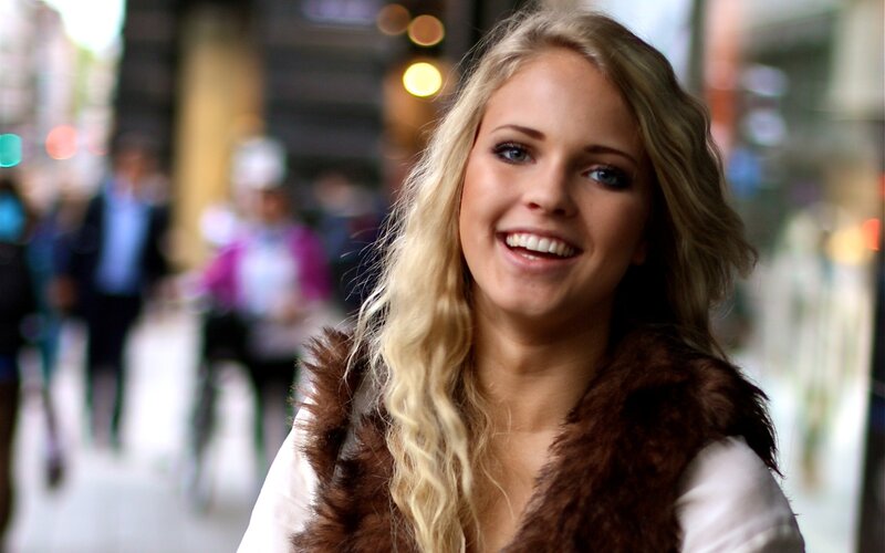 Smiling woman in city