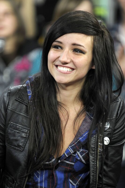 Smiling woman in leather jacket