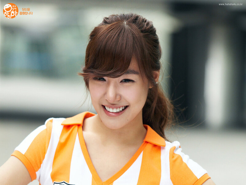 smiling woman in orange and white
