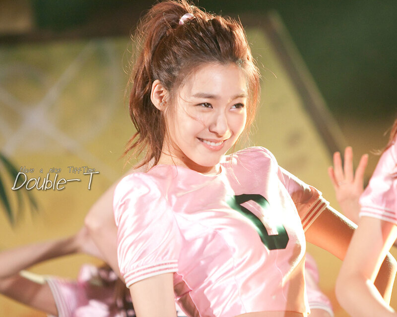 smiling woman in pink shirt