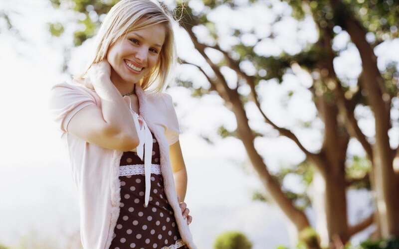 Smiling woman in polka dot dress