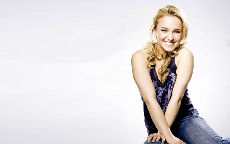 smiling woman in purple top