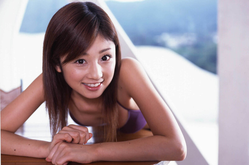 smiling woman in purple top