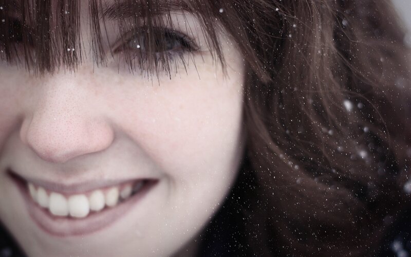 smiling woman in snow