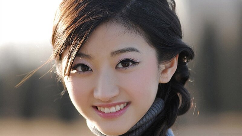smiling woman in sunlight