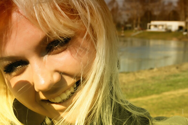 Smiling woman in sunlight