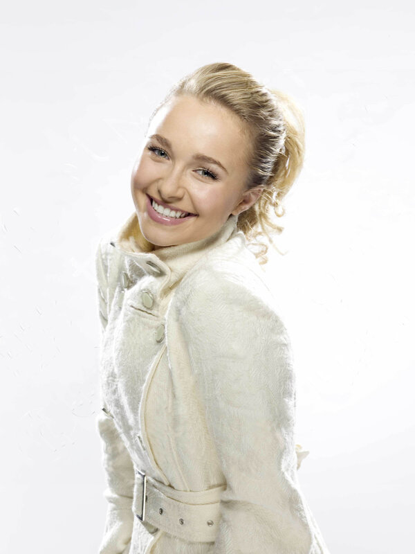 smiling woman in white coat