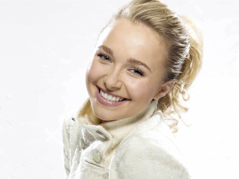 smiling woman in white coat