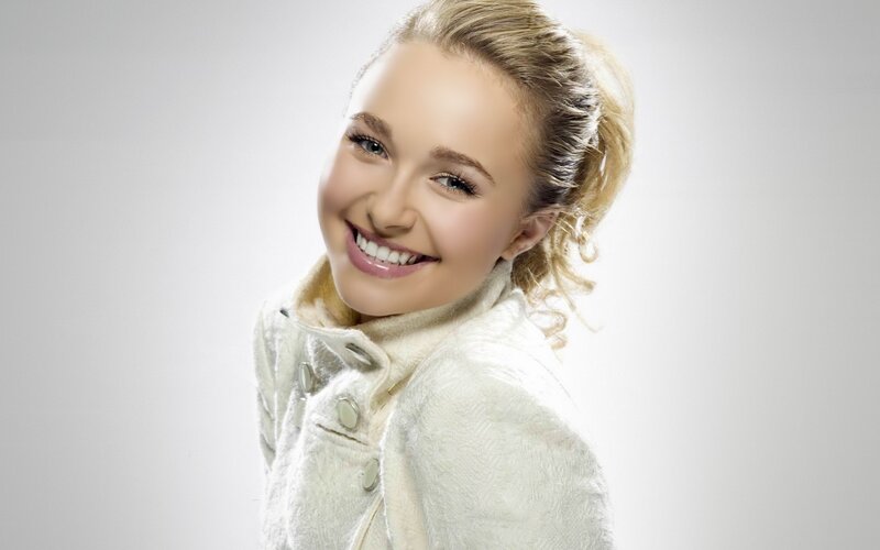smiling woman in white coat