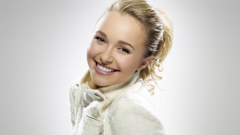 smiling woman in white coat