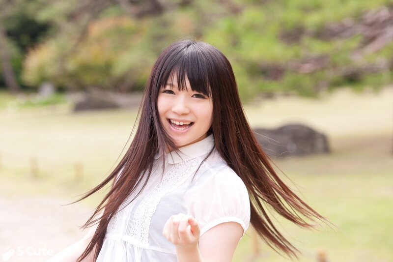 Smiling woman in white dress