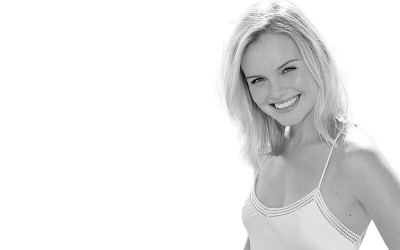 smiling woman in white top